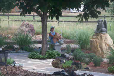 Stephanie tests one of the garden benches